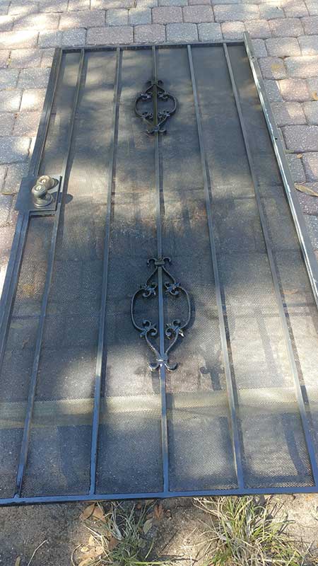 steel security door repaired and painted